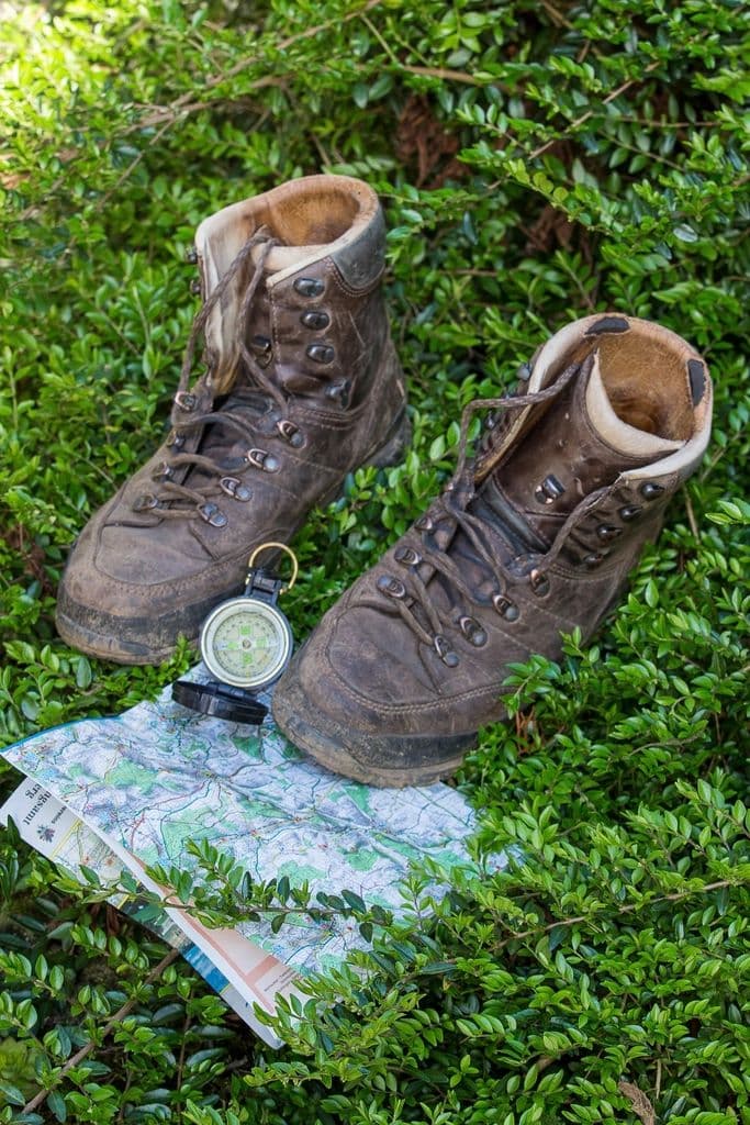 Ridgeway Hiking Boot, alternate view: Pair of saddle-brown hiking boots on grass next to a trail map and compass