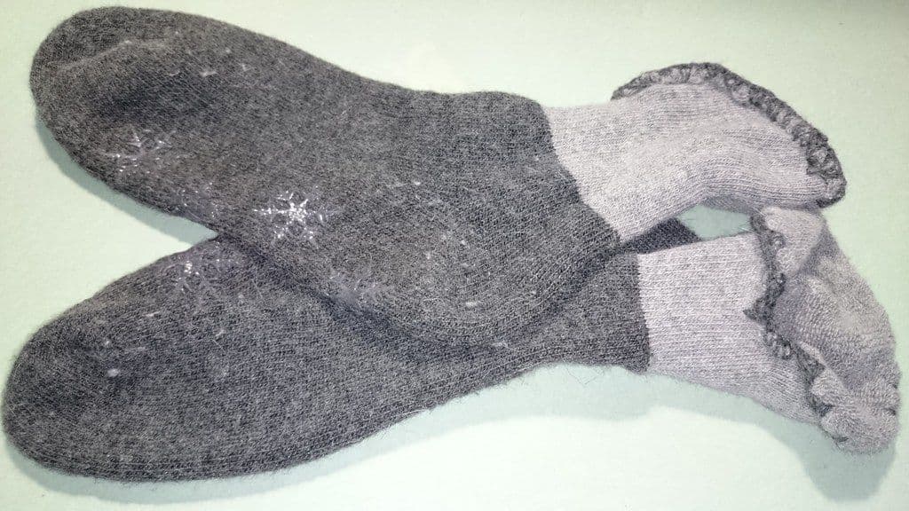 Thumbnail: Pair of charcoal and light-grey wool hiking socks laid flat