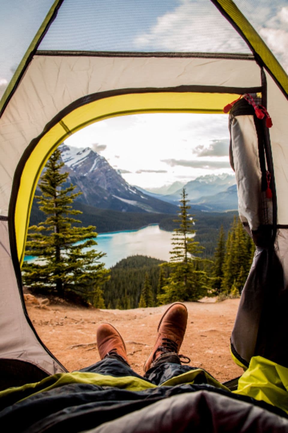 Basin 2P Tent, alternate view: View out of a citron-trimmed tent door to a turquoise mountain lake and pines